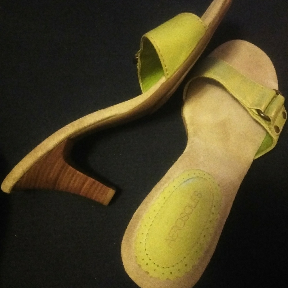 Lime color slip on heels with a buckell on top